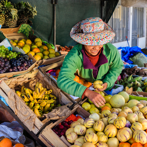 Women selling fruit from a small stall