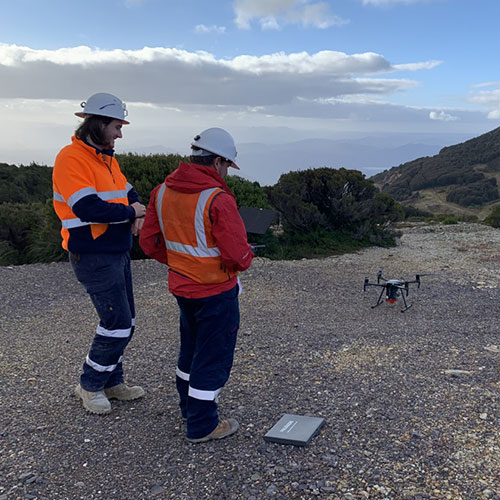 People operating a small drone