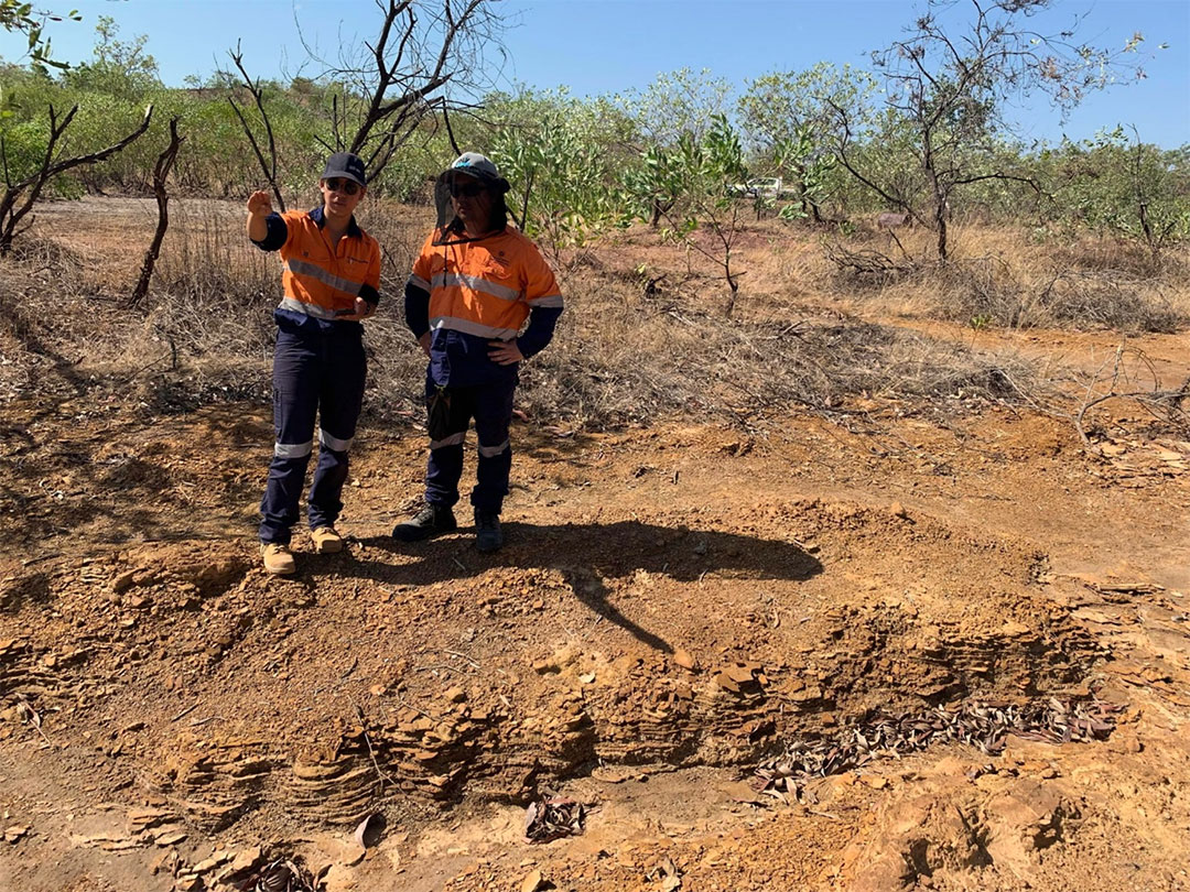 Kam Bhowany and Zhengdon Han standing on sampled tailings deposits. 