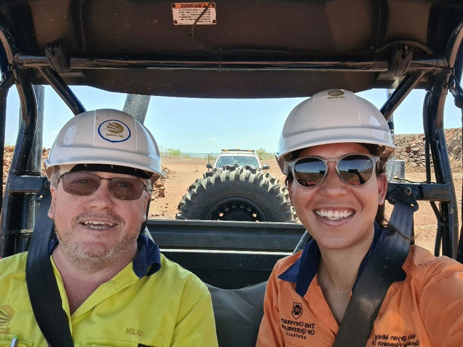 Glen and Kam on a tour of the site in a buggy, closely followed by Thomas