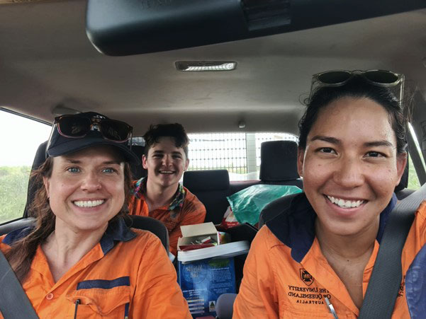 Katerina Savinova, Joshua Crow and Kam Bhowany taking a self photo in a car.