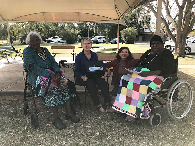 Sarah and Hannah Corbett from the CLC (centre) with Mavis Nampitjinpa and Barbara Marks at Old Timers