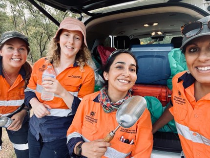Laura Jackson, Rosie Blannin, Olivia Mejías and Anita Parbhakar-Fox in PPE posing at the back of a vehicle