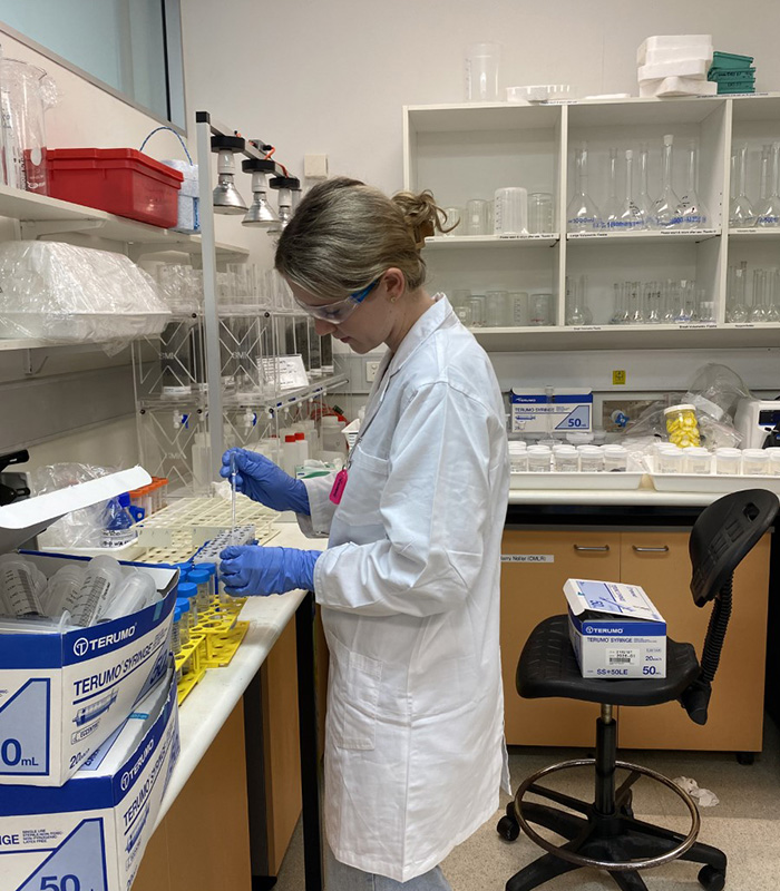 Sabrina Newton pipetting in the SMI lab