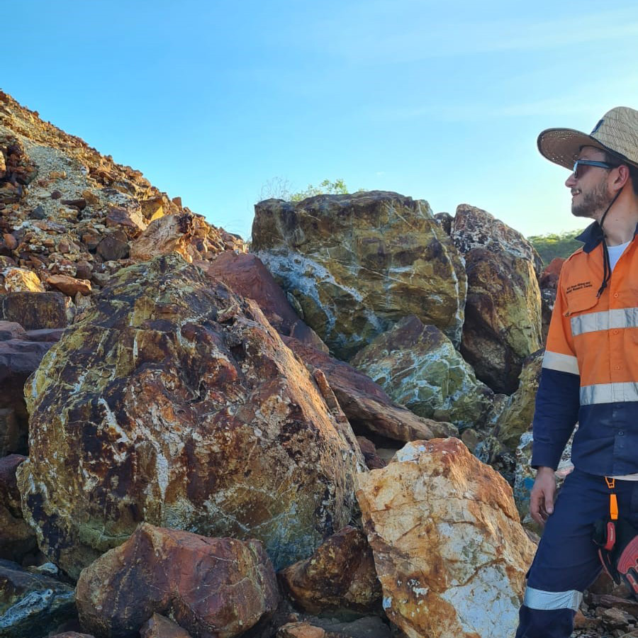 Allan Gomes next to rock hill on the field work at Croydon mine site, Queensland