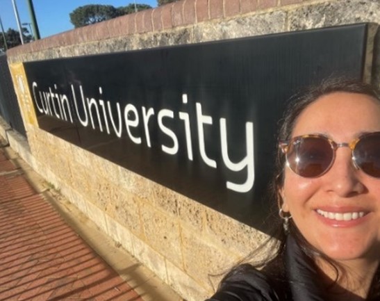 Olivia Mejias in front of Curtin University sign