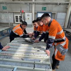 Students examine core samples ay Oyu Tolgoi, Mongolia. Credit: Andre van As