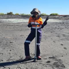 Sibele Nascimento hand-augering in the field