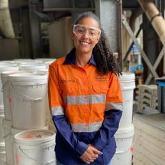 Sibele Nascimento standing in front of bulk samples