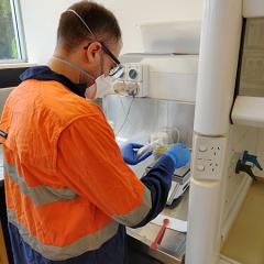 Gabriele Baldassarre working in the lab