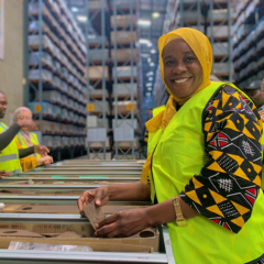 Female worker in bright PPE  